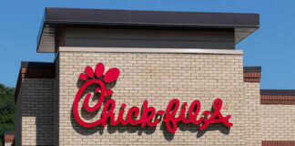 Chick-fil-A restaurant sign on a brick building