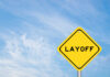 1,400 Layoffs – Days Before Trump Yellow warning sign displaying the word 'LAYOFF'
