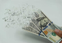 Fake Fans, Real Cash – $8M Vanishes Hundred-dollar bills disintegrating in hand.