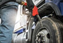 Red Diesel Goes Legal – For Now Person fueling a large truck with a gas pump