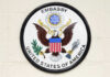 Seal of the United States Embassy featuring an eagle and national colors
