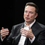 Musk’s ‘Pet Destroyers’ Bombshell Sparks Fury Elon Musk speaking and gesturing with hands in discussion.