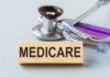 Medicare Shock: Plan Purge Looms Wooden block with MEDICARE text next to a stethoscope