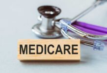 Wooden block with MEDICARE text next to a stethoscope