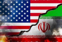 A cracked wall displaying the flags of the USA and Iran, symbolizing conflict